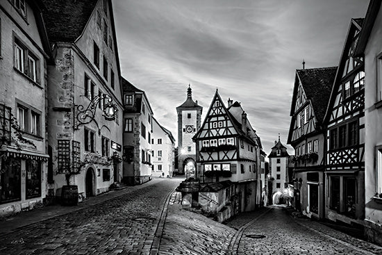 Martin Podt MPP1249 - MPP1249 - Rothenburg ob der Tauber - 18x12 black and white village street, old European town, cobblestone road, half-timbered houses, historic architecture, monochrome cityscape, clock tower, empty street, moody urban scene, medieval town, fine art photography, classic travel image, old world charm, narrow lane, dramatic clouds, timeless streetscape, quaint village, architectural details, nostalgic European street, grayscale photography from Penny Lane